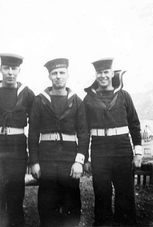 Three unidentified shore patrol.