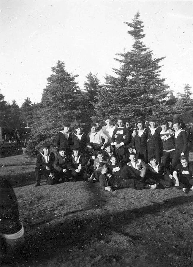 Mixed group of shore patrol and sports team.