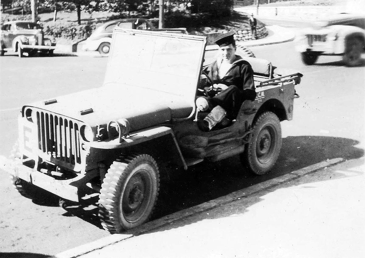 Unidentified shore patrol in jeep.