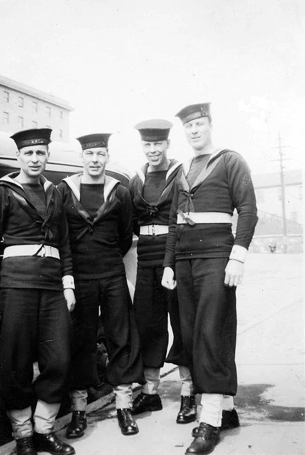 Four unidentified shore patrol.