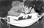 Unidentified sailor with kittens on HMCS Sioux, 1944/45
