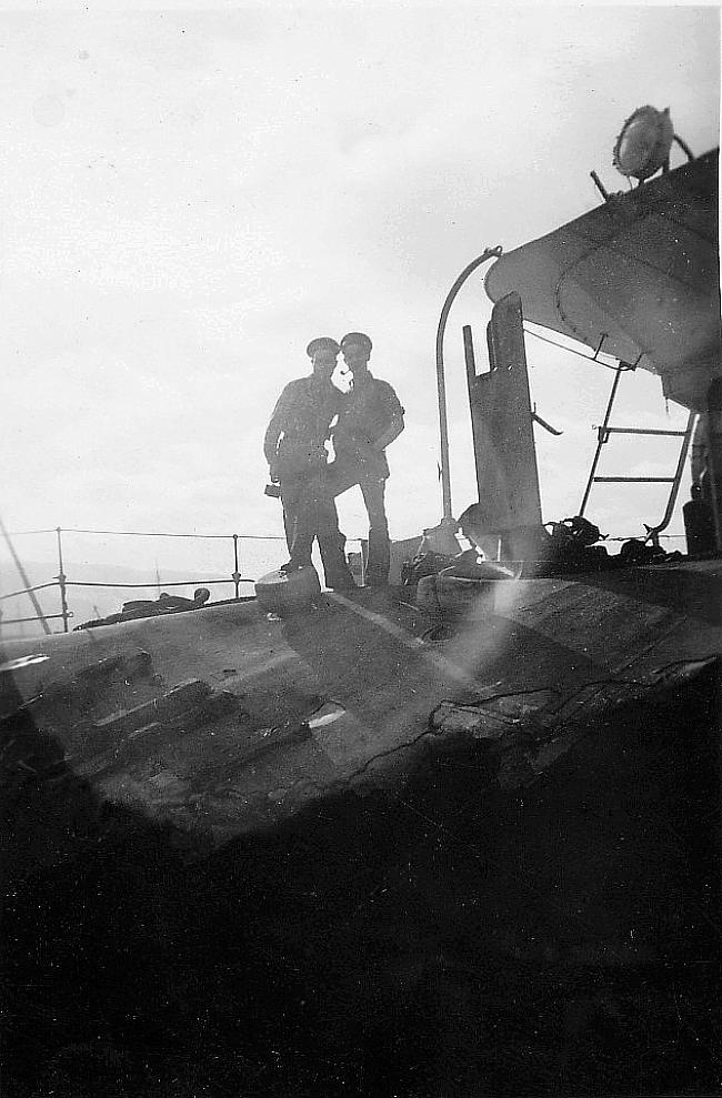 Unidentified standing on HMCS Saguenay.